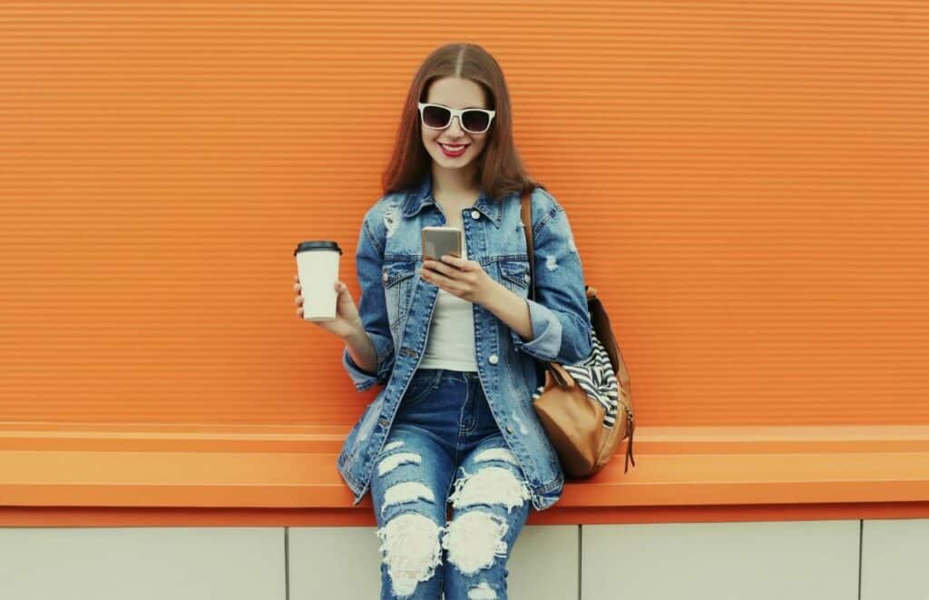 Blogger Influencer scrolling social media on her phone