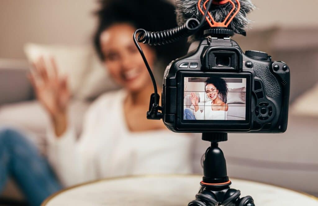 Black YouTube Vlogger recording video. Keep reading to get the best goal setting statistics for your blog. Keep reading to learn the answer to the question, "Is Blogging Still Relevant?"