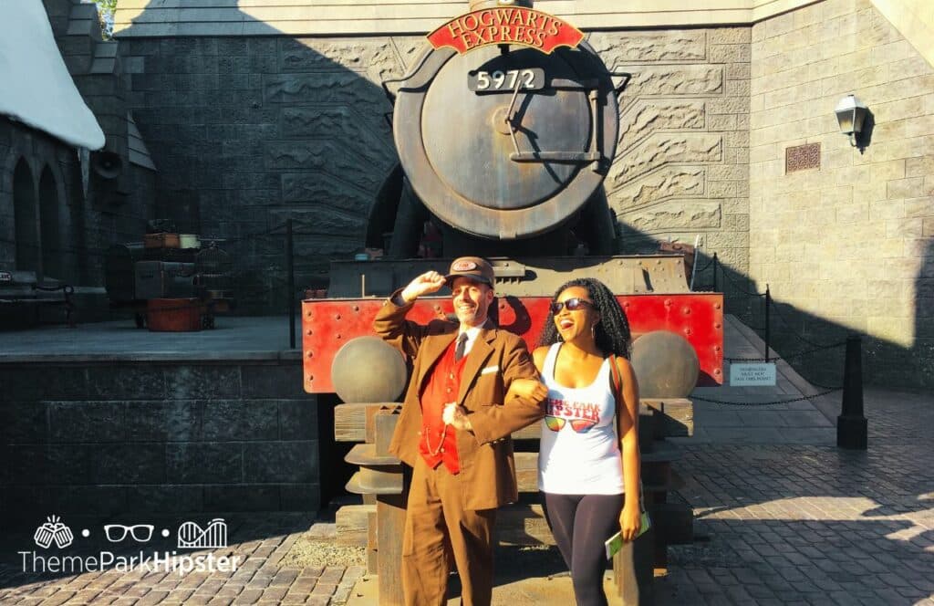 NikkyJ in front of Hogwarts Express Harry Potter World Universal Studios Hollywood California. Keep reading to learn how this theme park blogger and Disney blogger makes money.