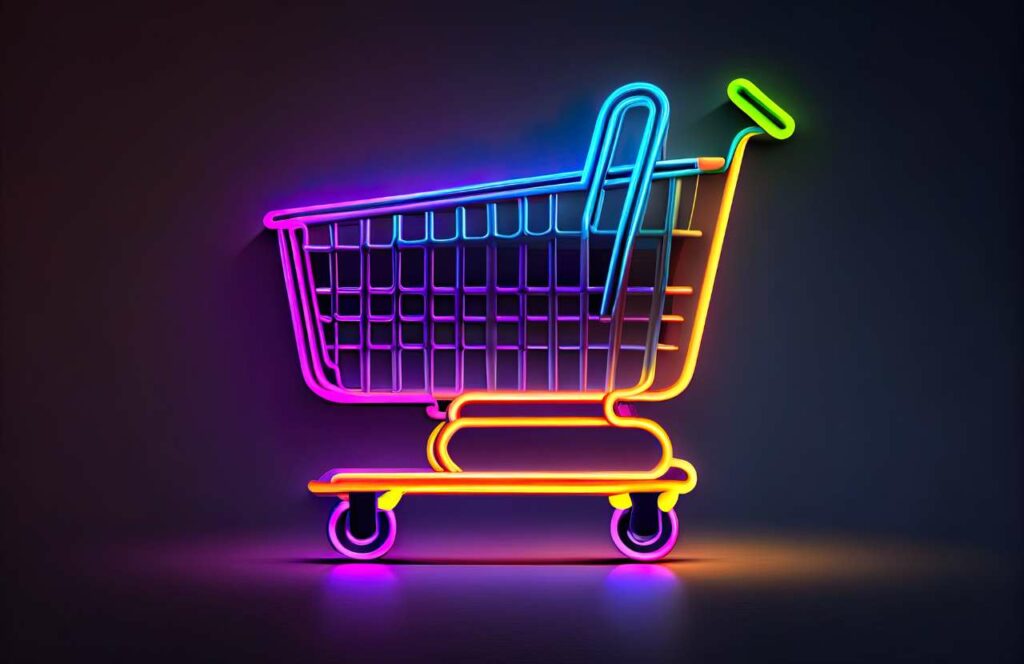 A multi-colored neon shopping cart on a dark back.  Learn more about conversion rate optimization for your blog.