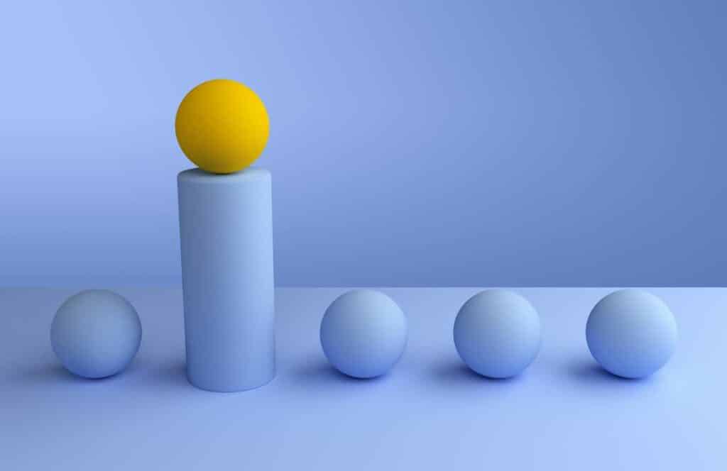 Five balls with all but the second one is blue and lifted on a pillar to signify uniqueness in building a brand online with your blog. If you have ever asked "What's the point of blogging?" click here to read more.