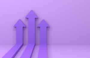Three dark purple arrow pointing up with a light purple background wall and floor.