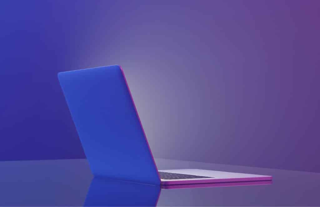 A Macbook air sitting open on a desk with purple background and blue lighting