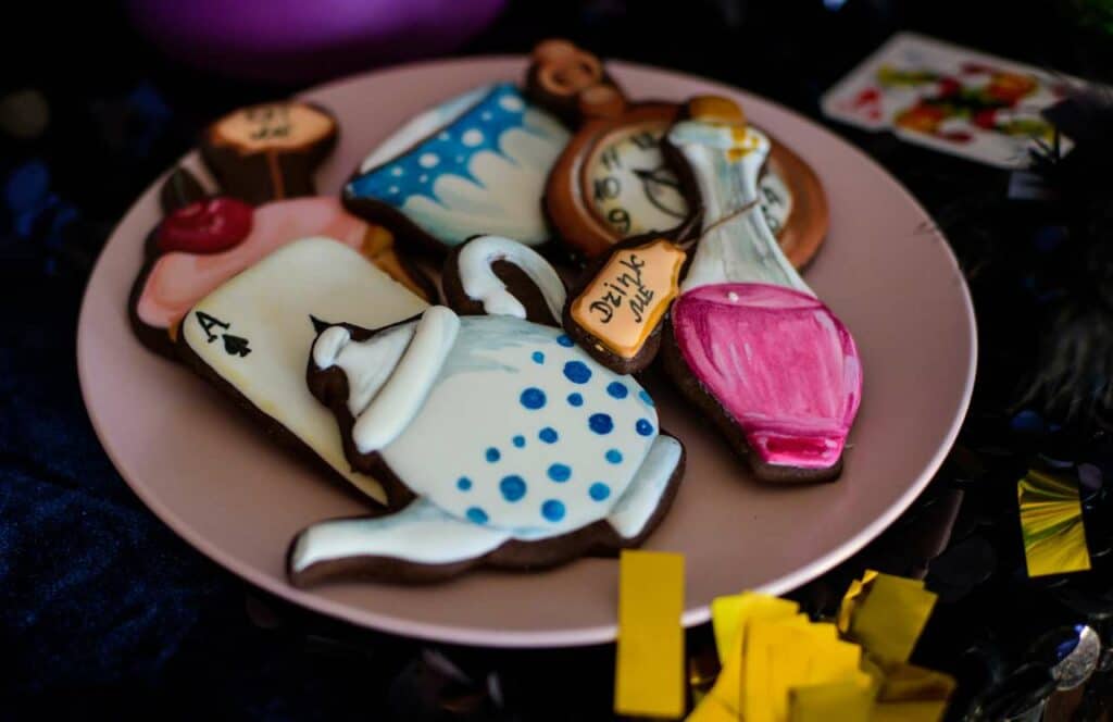 A plate full of Alice and Wonderland cookies which reference the Mad Hatter starting at the beginning. If you want to learn how to build brand awareness for your blog, then keep reading.